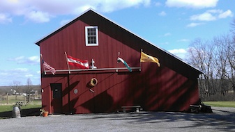 OTHER_Wine_Barn_With_Flags-337x190